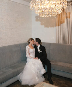 Bride and groom sit in cocktail lounge