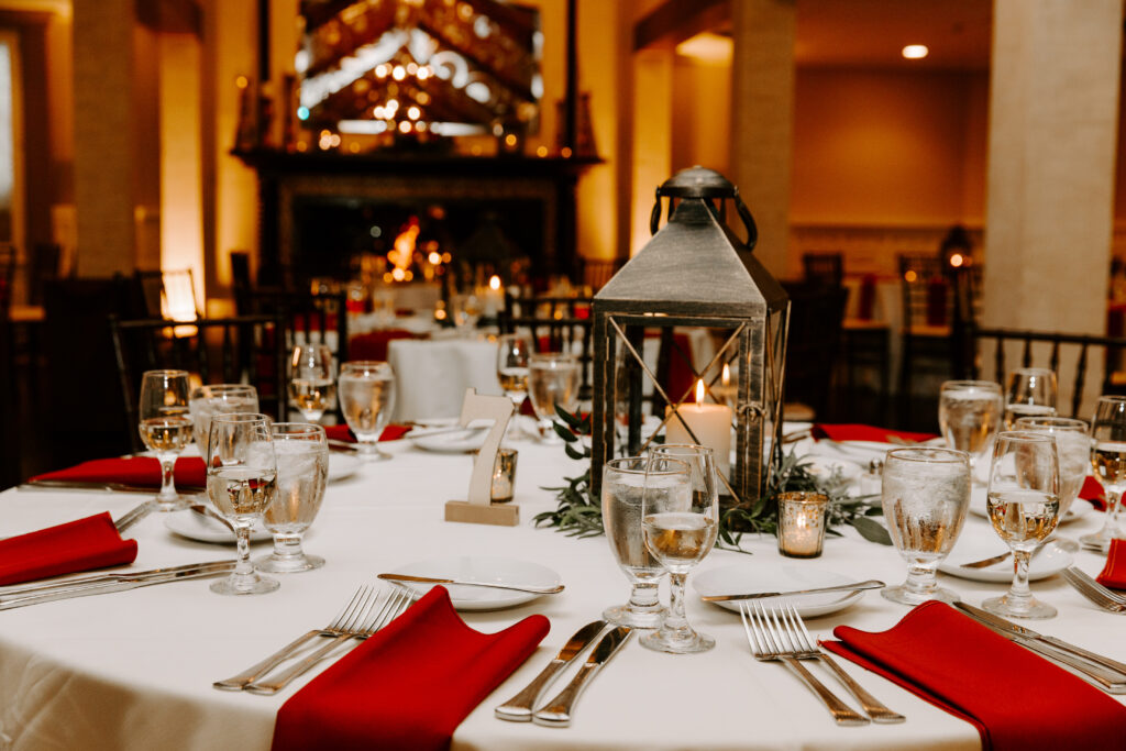 Lantern Centerpiece with Red Napkins for Fall Wedding