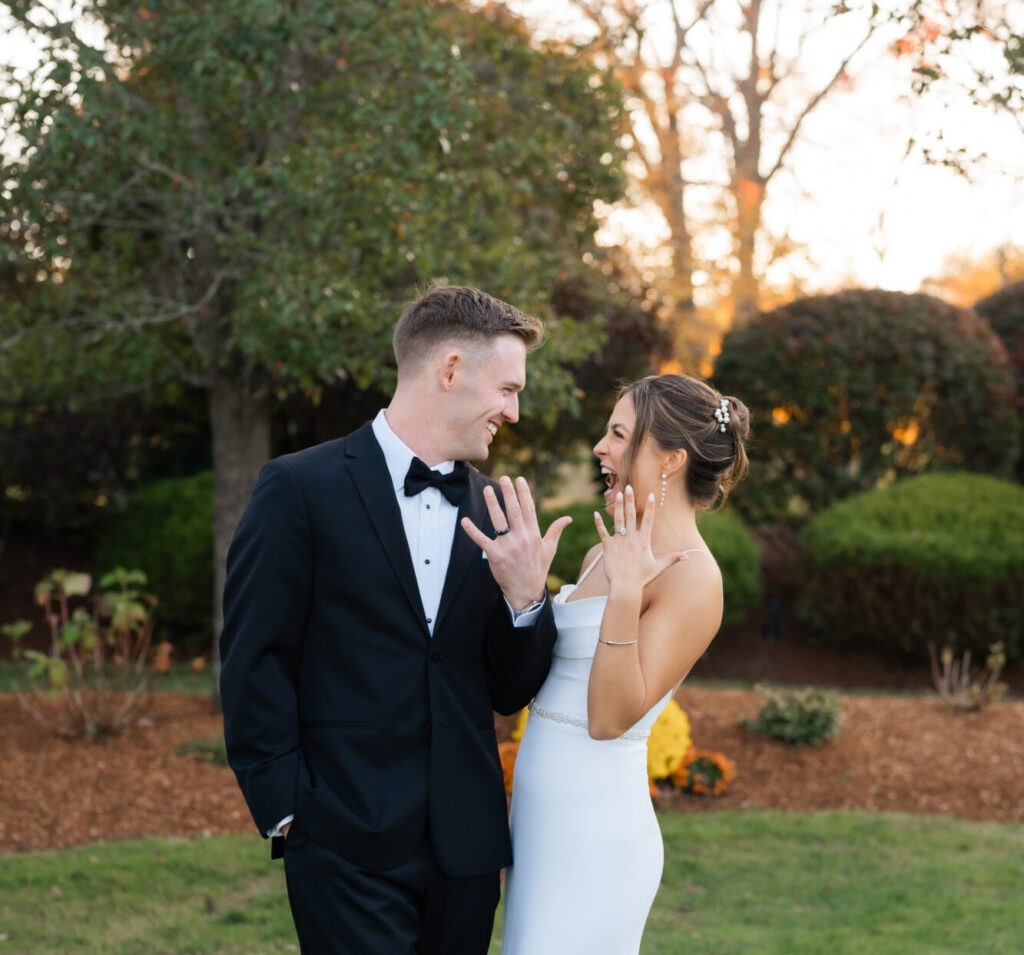 Bride and groom show off rings