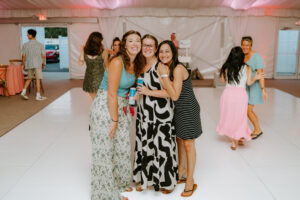 staff poses on the dance floor