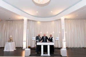 Vendors pose at recepting in Avenir ballroom