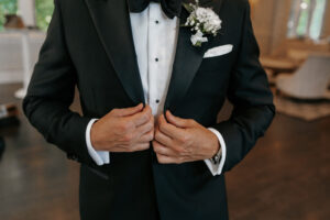 Groom's tux getting ready before wedding