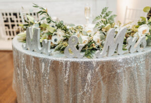 Sparkle and metallic finish wedding sweetheart table linen at New Year's Eve wedding